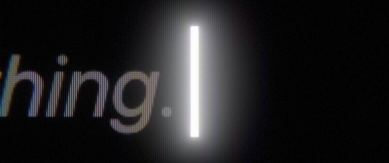 The end of the typed thought, '…thing.', and a glowing text cursor.